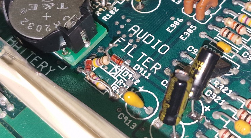 Picture showing the resistor R911 with one leg lifted